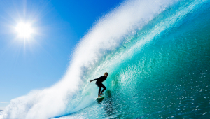 A surfer expertly riding a big wave